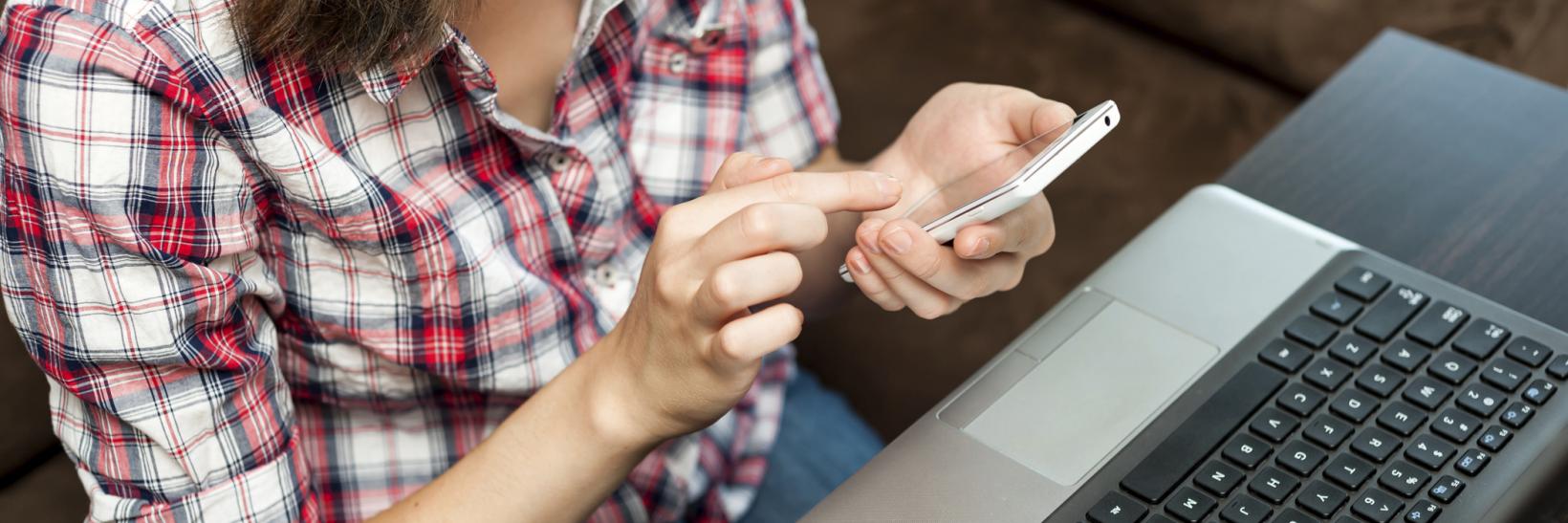 girl on her laptop and cell phone