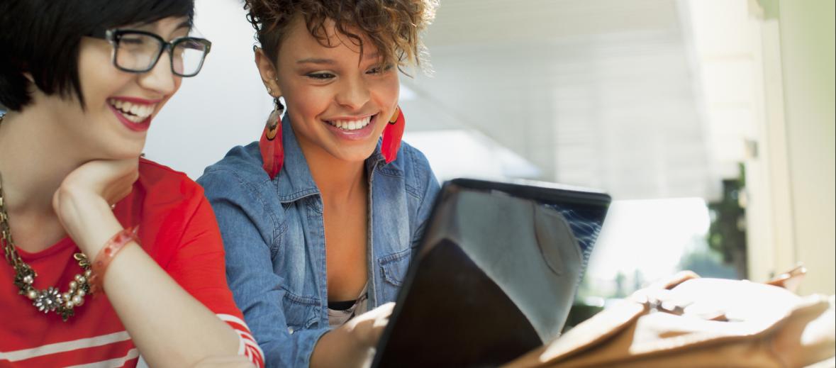 Two women looking at a computer