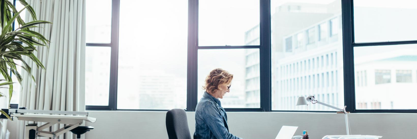 A designated school officials reads about the upload evidence functionality on her computer