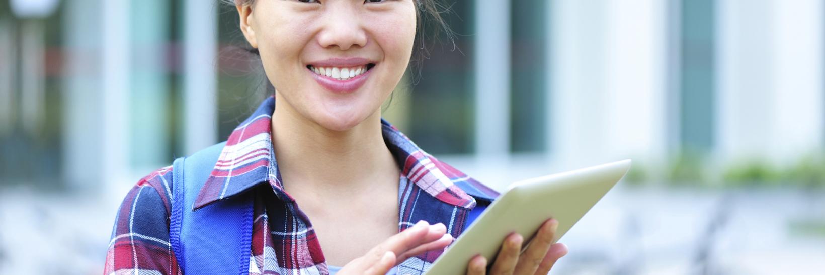 asian college student on a tablet