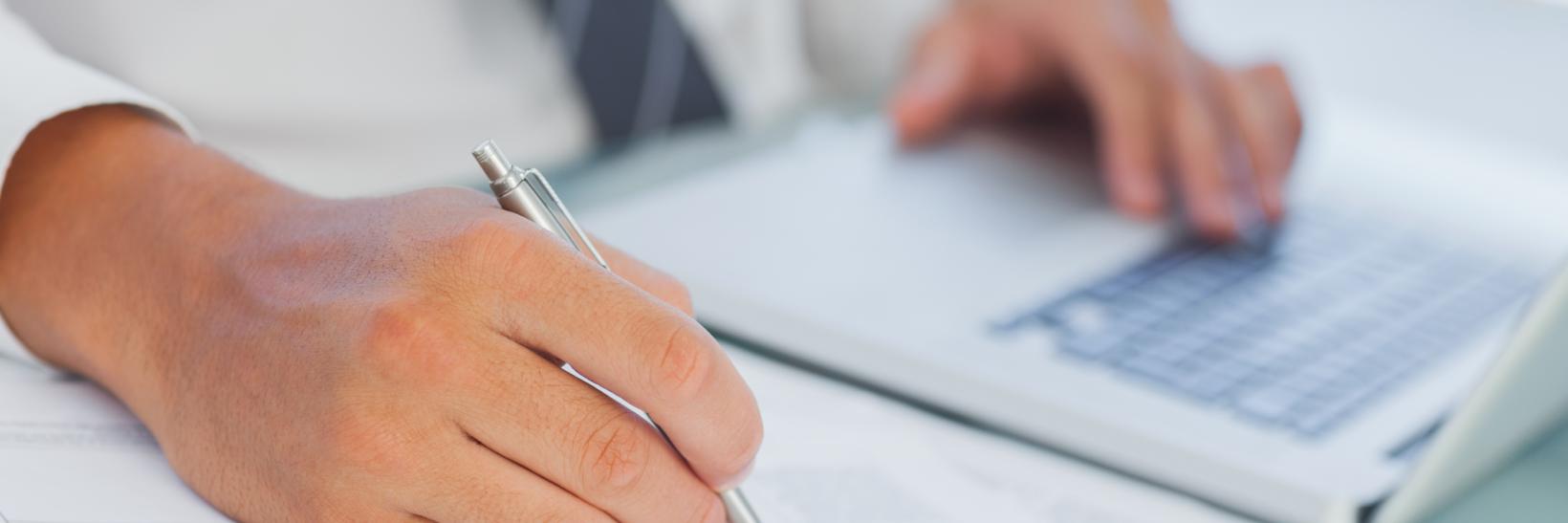 man filling out paperwork