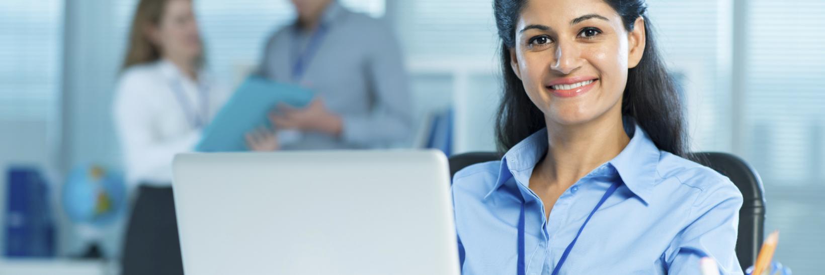woman sitting in front of a laptop