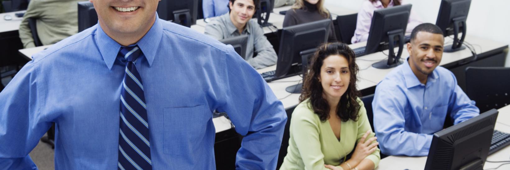 teacher and students in a computer lab