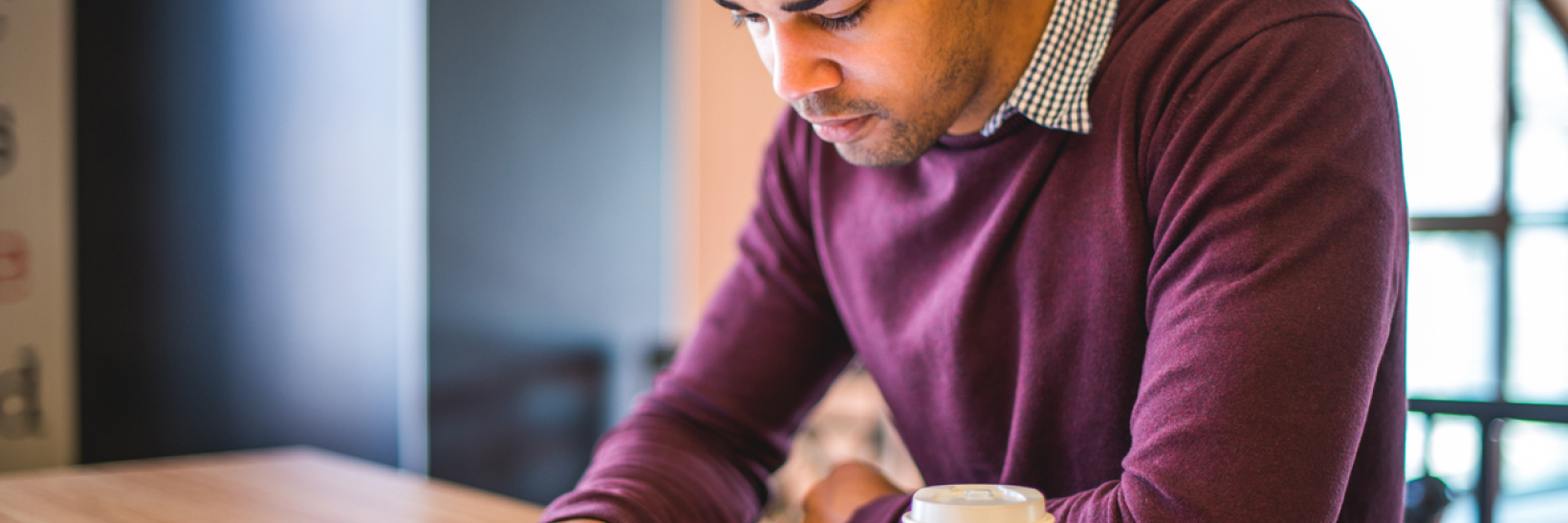 A man reading the SEVP Spotlight on a tablet. 