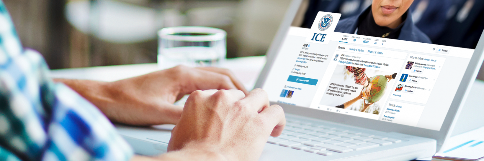 Person on a laptop with the ICE Facebook page on the screen