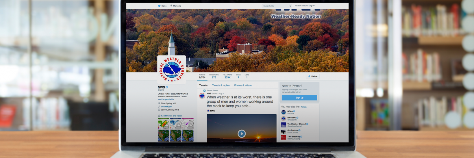 Laptop on a table with National Weather Service Facebook page