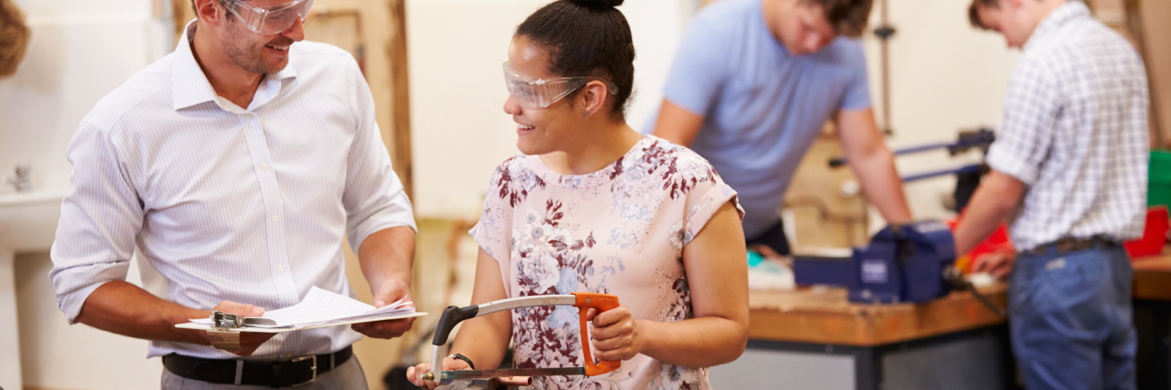 Student and teacher working in a wood shop class.