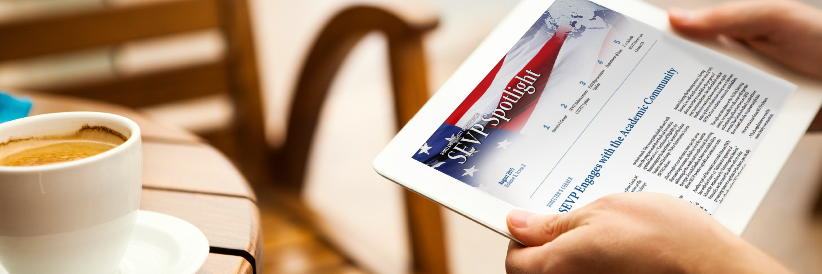 person reading SEVP Spotlight on a tablet