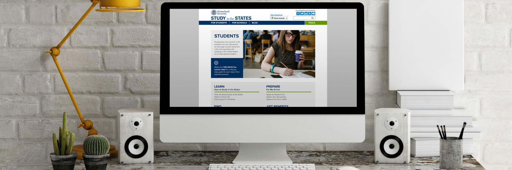 Computer screen on desk with the Study in the States Students page loaded on the screen.