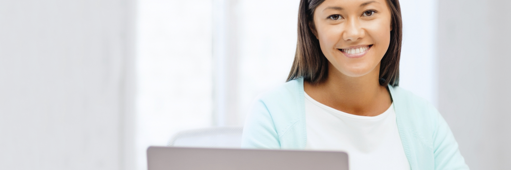 student in front of a computer