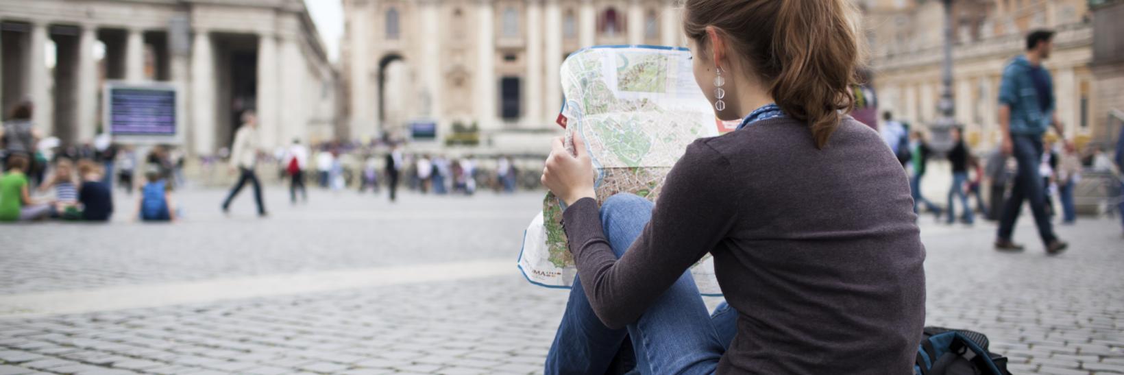 woman reads a map