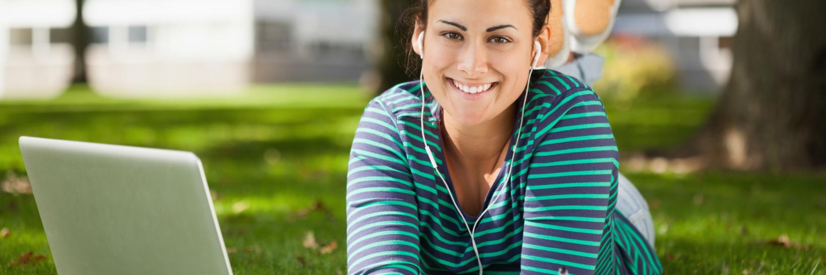 young woman at a laptop in the park