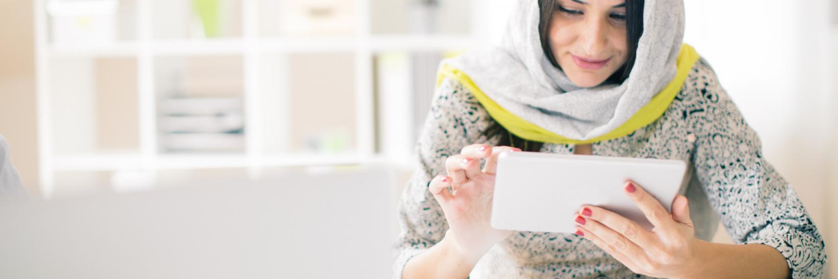 A woman using an tablet computer.