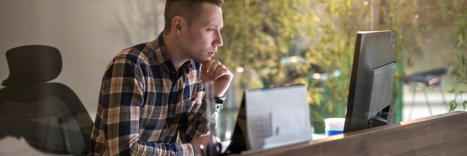 A man using a laptop computer.