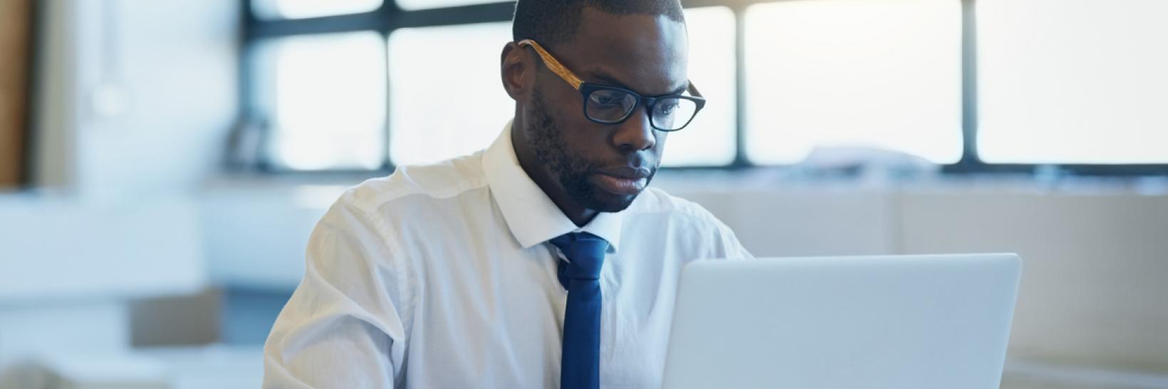 A designated school officials reads about SEVP recertification and SEVIS annual verification on a computer