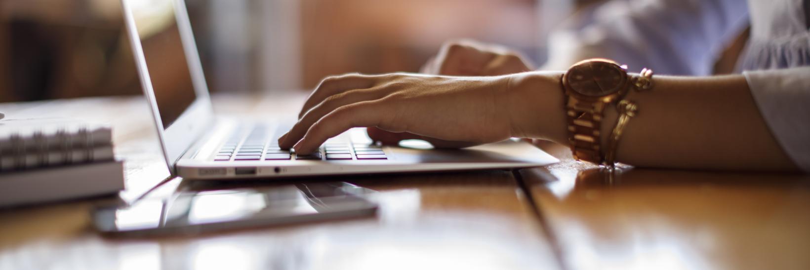 Woman typing on her computer