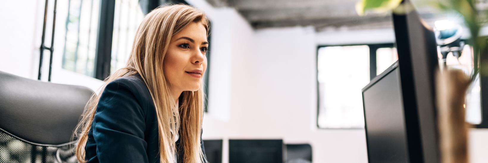 Woman looking at a computer