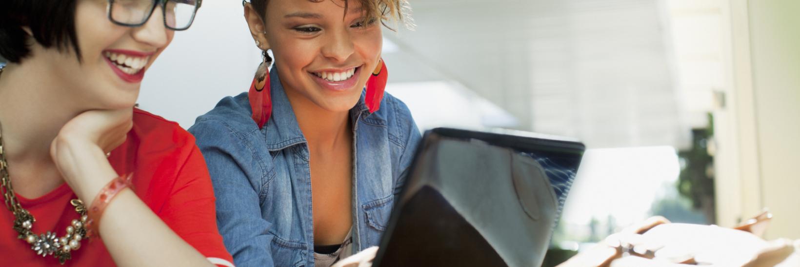 young girl looking at a computer