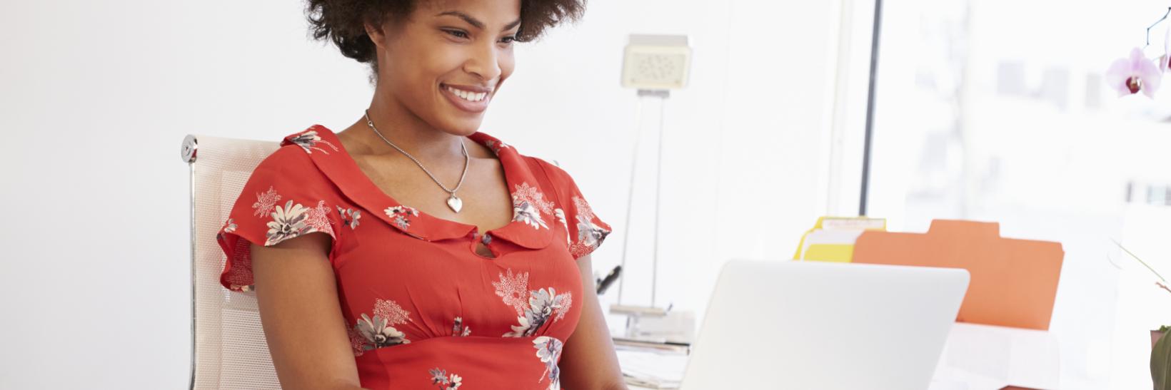 Woman reading laptop