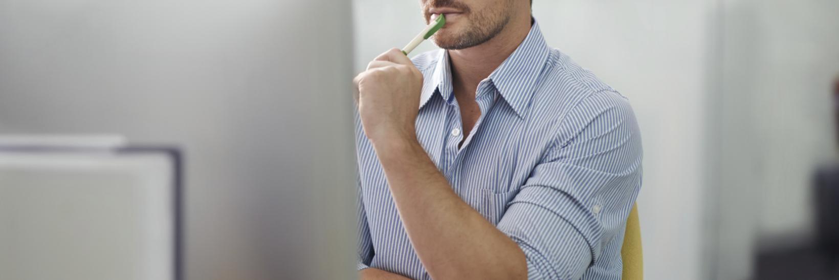 man reading from a computer screen