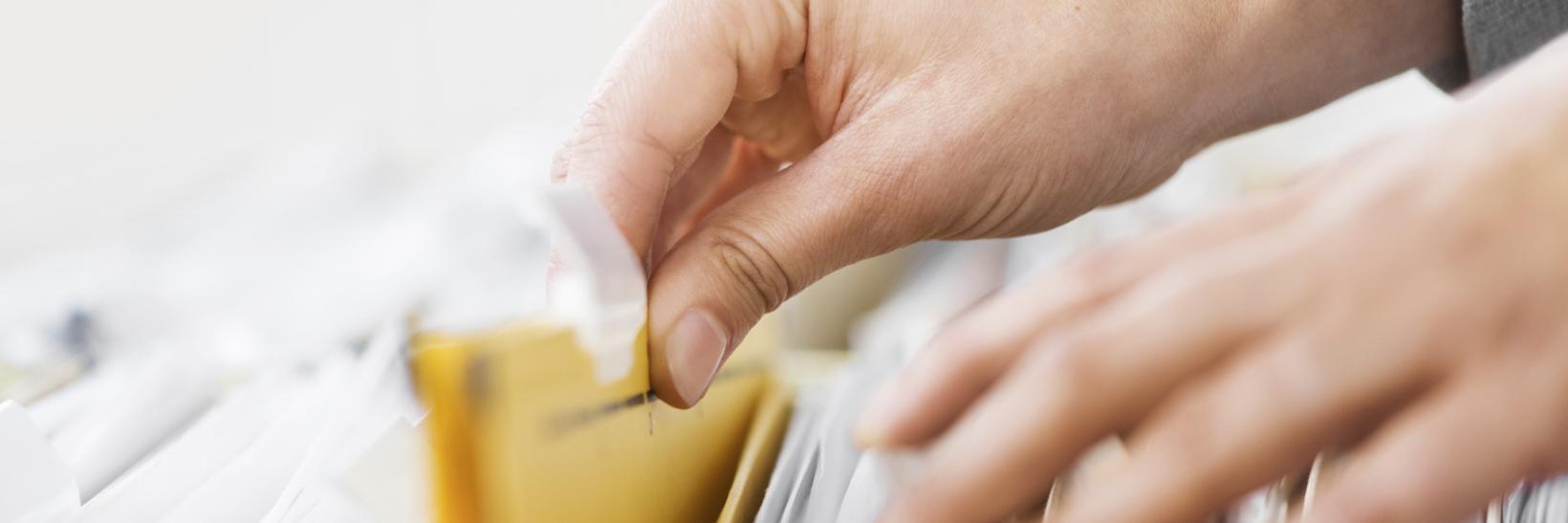 A person looking through files.