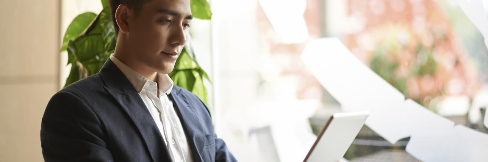 A man using a tablet. 