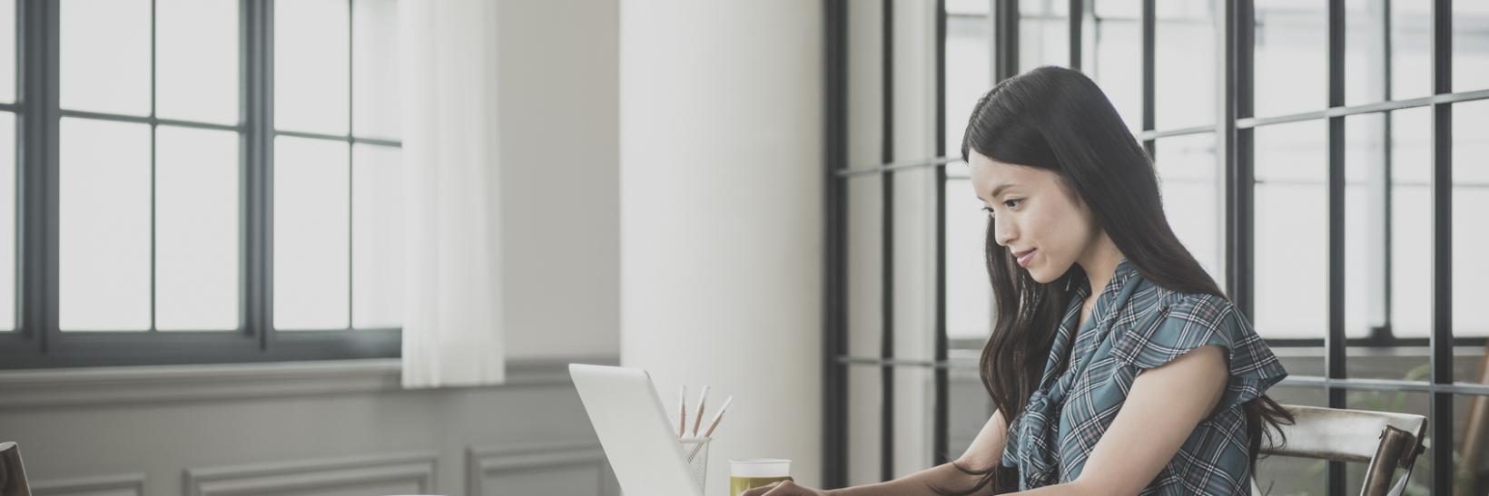 A woman using her laptop computer.