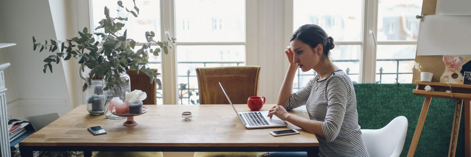 A woman working on her computer.