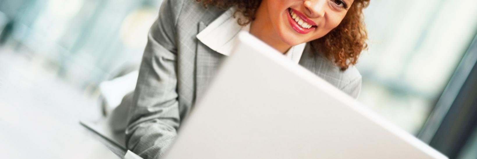 Woman uses computer.