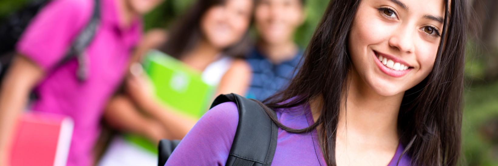 Girl on campus with friends.