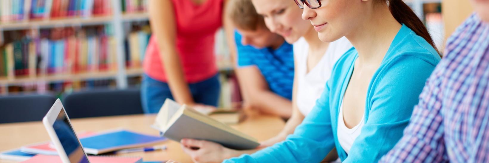 Students working in library. 