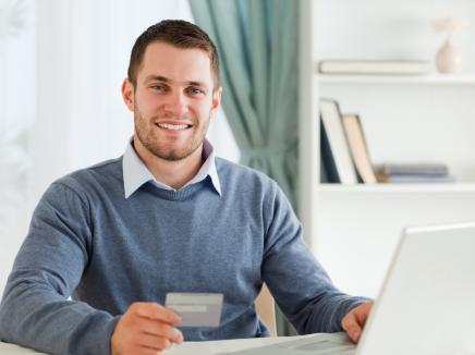 man paying a fee online