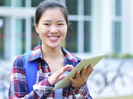 asian college student on a tablet