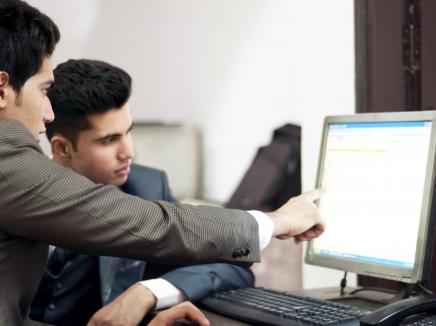 men at a computer 