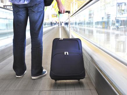 man holding a suitcase