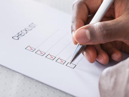 hand writing on a checklist