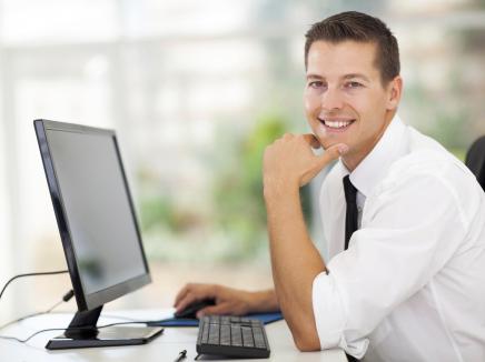 man sitting at a computer