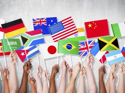 hands holding up international flags