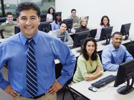 teacher and students in a computer lab