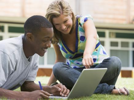 students working on a laptop