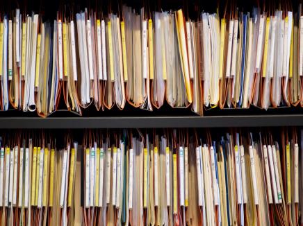 Files on a shelf.