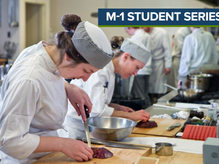 A culinary student slicing meat in class. 
