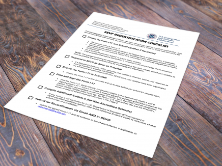 SEVP Recertification Checklist on a wooden table. 