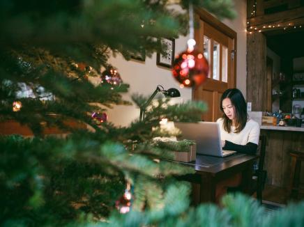 A woman working on her laptop computer.