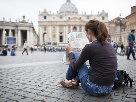woman reads a map