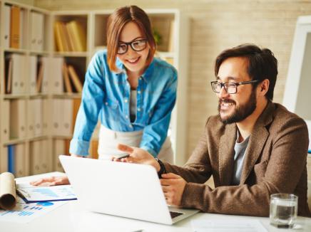 two adults in an office