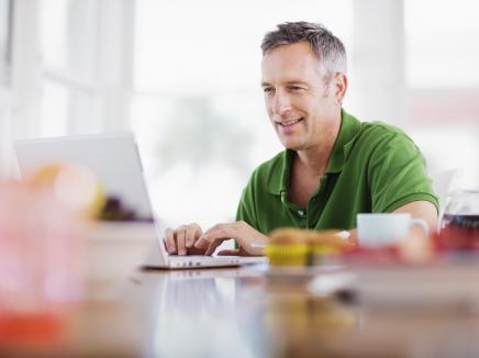 man sitting at a laptop