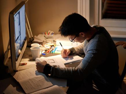 A student studying at their desk.