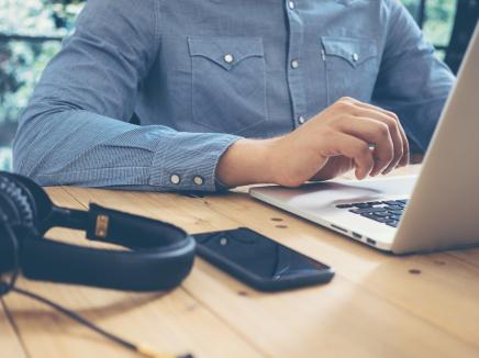 A man working on a laptop computer.