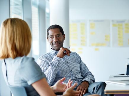 A man and woman having a conversation.